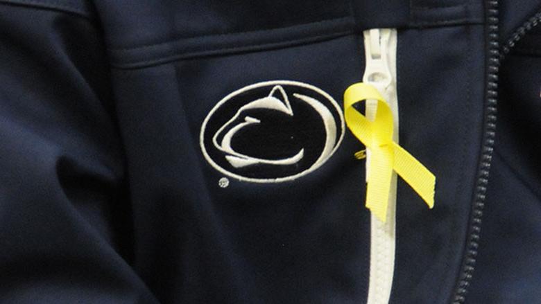 A student wears a yellow ribbon in honor of Veterans Day.